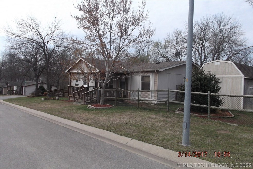 East side of home, covered front deck, completely