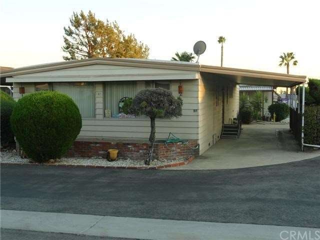 Front View with RARE drive through carport on corn