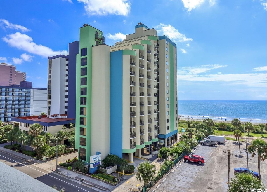 View of building exterior featuring a water view