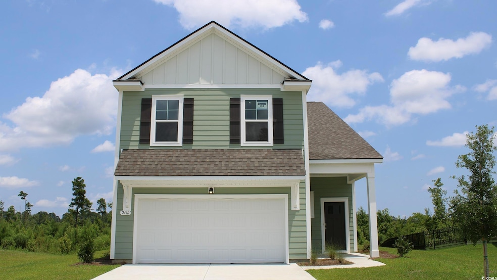 View of front facade with board and batten siding,