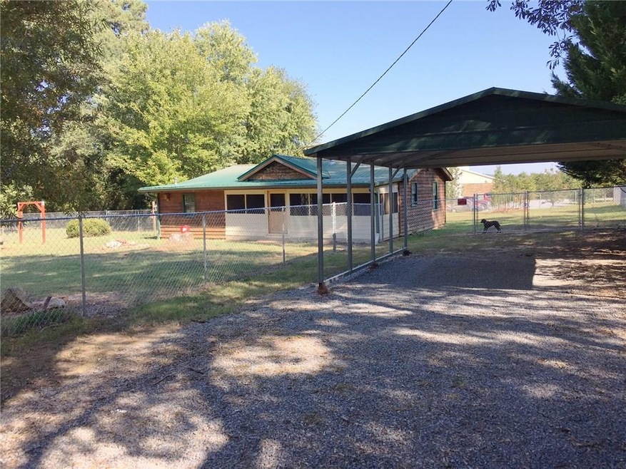 Front of home with 5' chain link fence