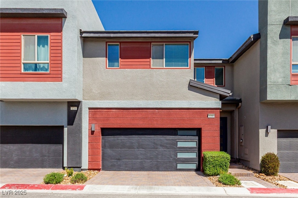 View of front of house with an attached garage, st