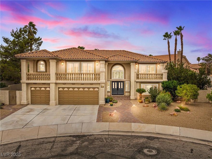 Mediterranean / spanish-style home featuring stucco siding, driveway, an attached garage, and a tile roof