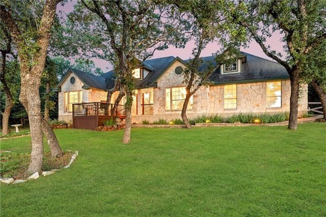 Beautiful single-story custom home with detached bonus space sitting on a 1.74 acre lot with mature trees and hill country views!