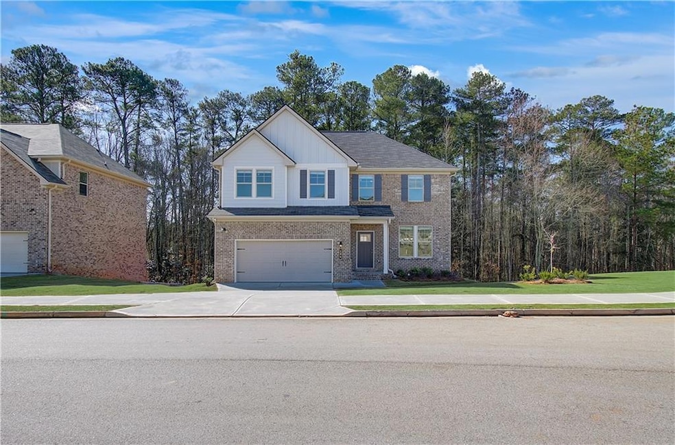 View of front of home featuring a front lawn and a