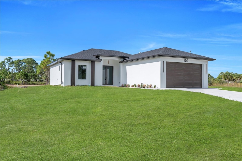 704 Holmes Ave, Lehigh Acres, FL 33974 - photo 1