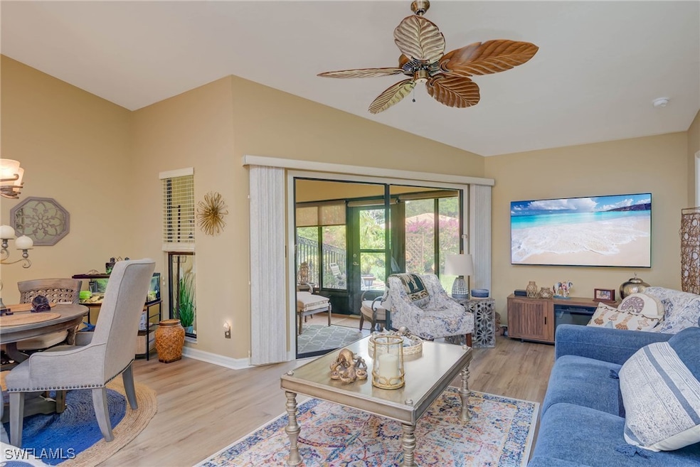 Living area with light wood finished floors, ceili