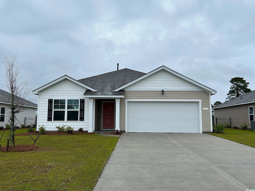 Single story home with driveway, a garage, and a shingled roof