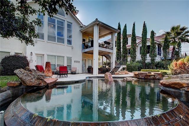 Landscaped yard with Custom Negative Edge Pool and