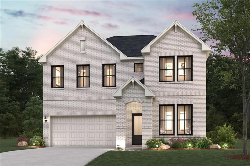 View of front facade with an attached garage, driveway, brick siding, and a lawn