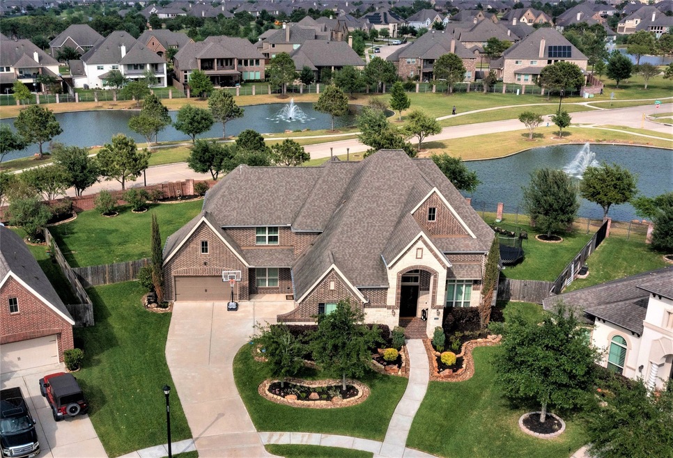 Welcome to 20302 Candle Canyon Court. This 4932 SF home is situated on an oversized 19,800 SF lot with a breath-taking lake and fountain view.