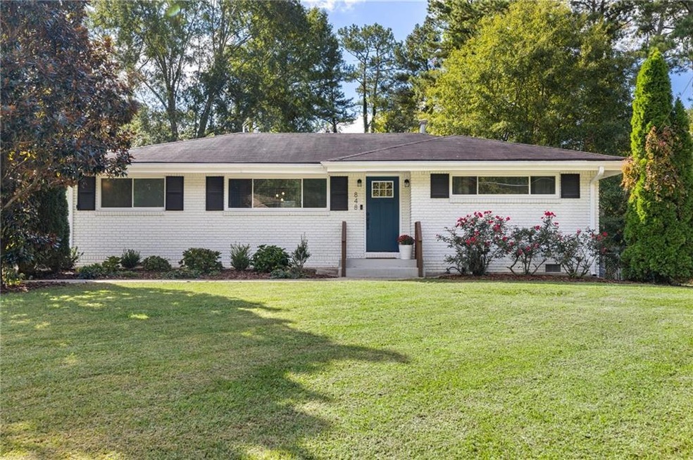 Beautiful white brick ranch on flat lot!