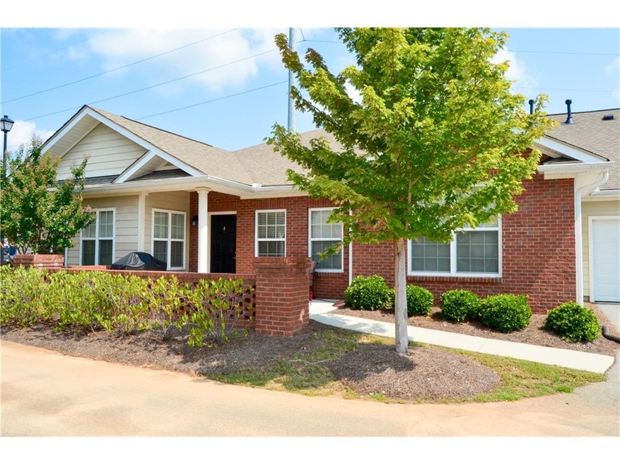 Exterior front with view of covered porch, patio a