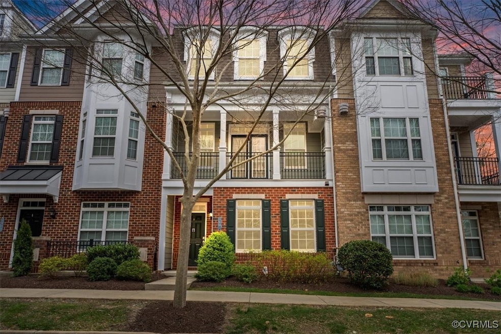 Townhome / multi-family property with brick siding