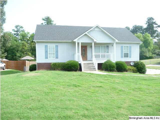 Home is on large level lot w/fenced back
