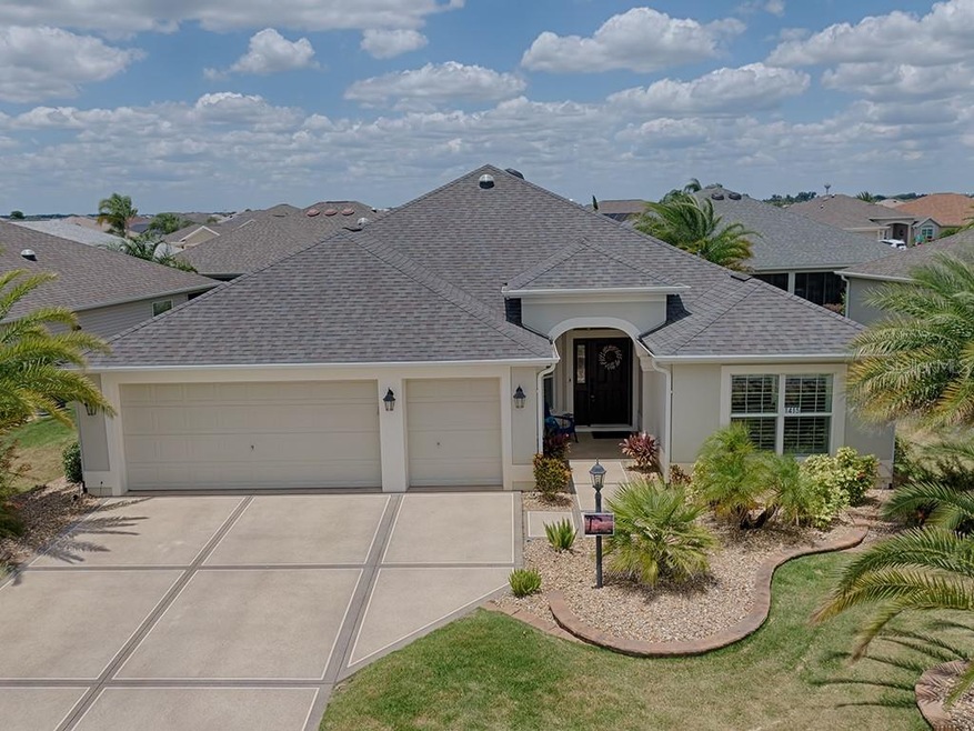 THIS HOME GREETS YOU WITH A PAINTED DRIVE & WALKWA