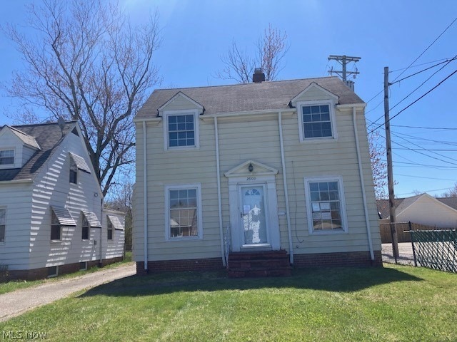 View of front of property with a front yard