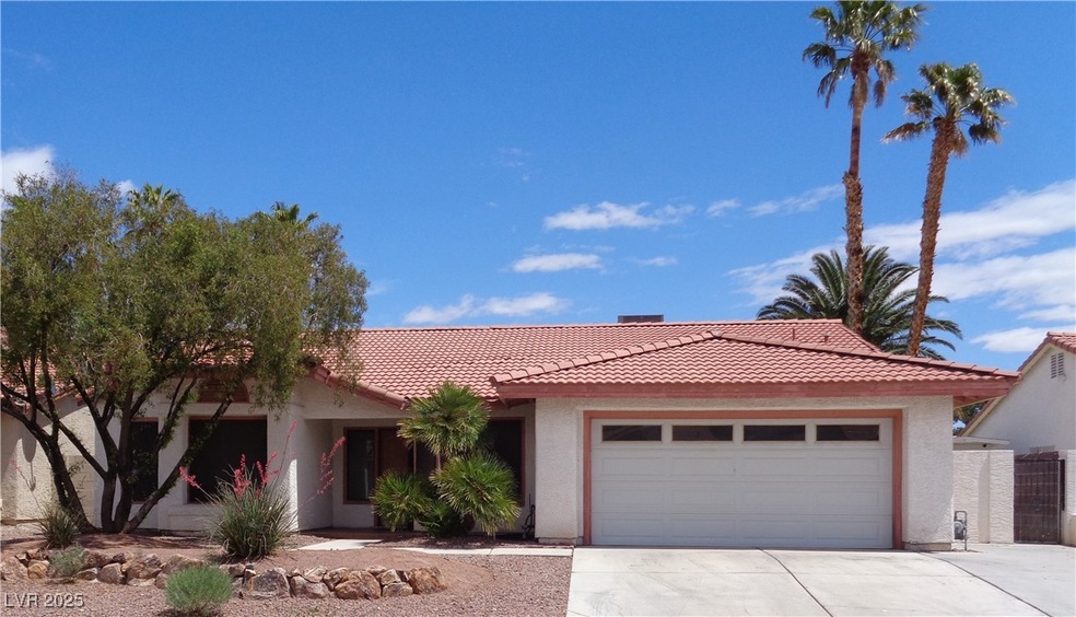 Single story home with an attached garage, stucco