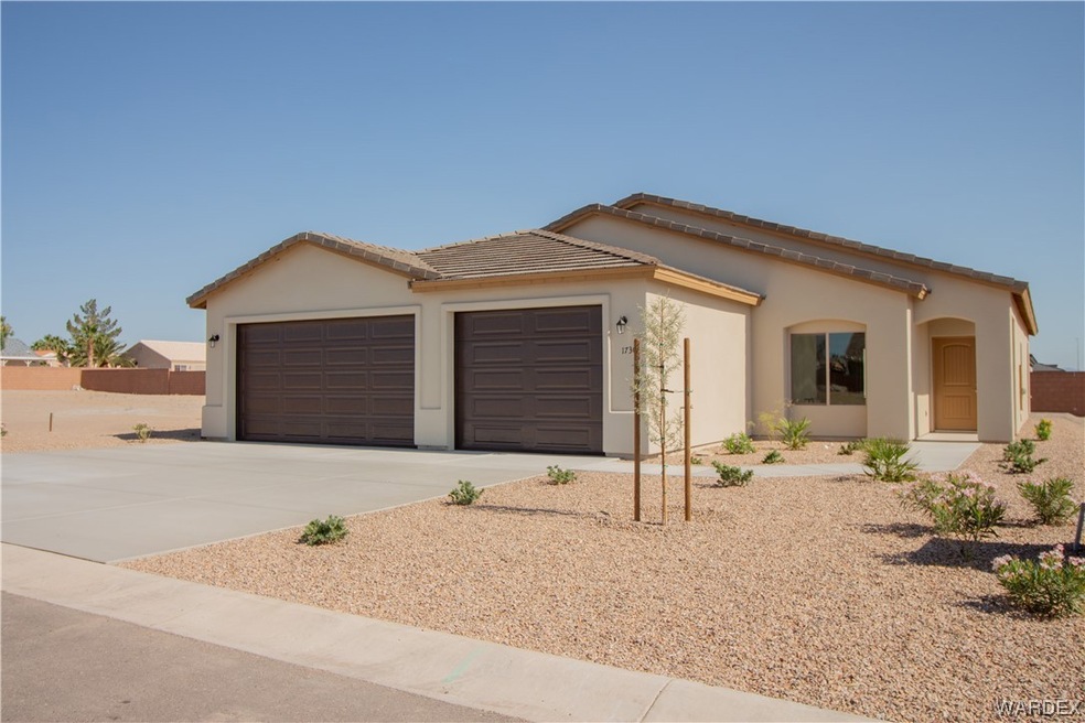 View of front of house, 3 car garage with pull thr