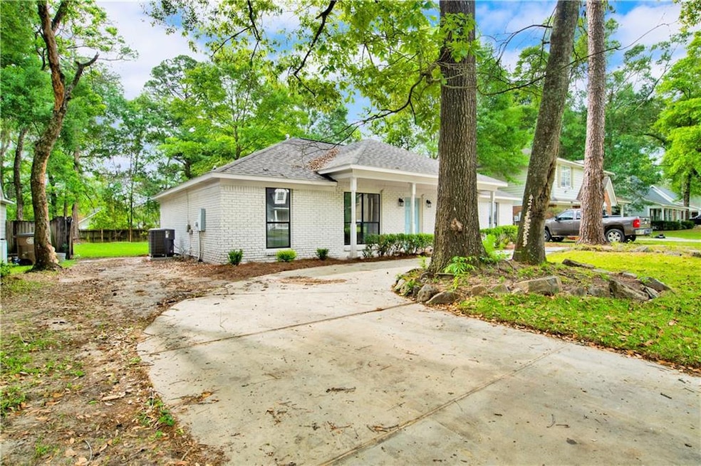 Single story home with covered porch, roof with sh