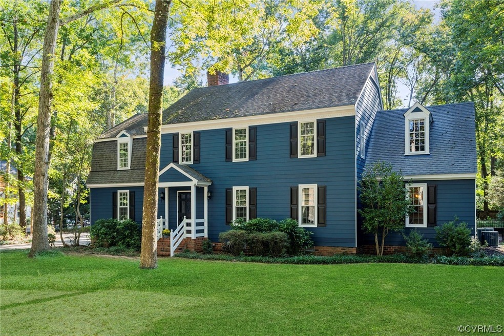 Colonial inspired home with central AC and a front