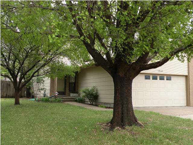 This half duplex is located on a tree lined street