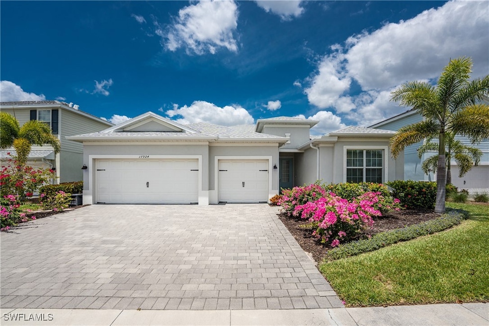 View of front facade featuring an attached garage,