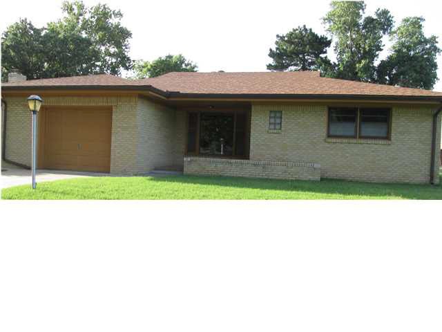 A covered front porch makes for a warm welcome at 