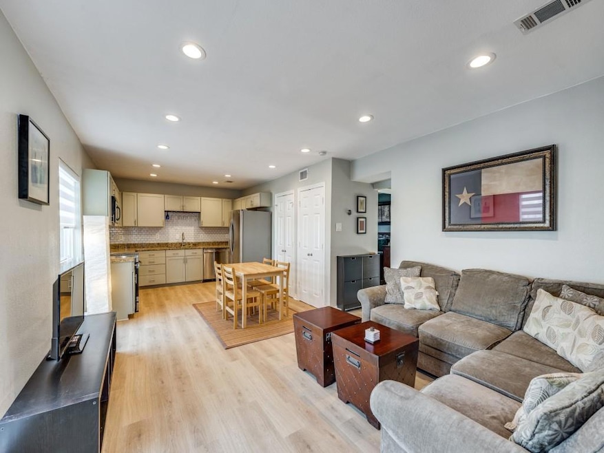 Living room with sink and light hardwood / wood-st