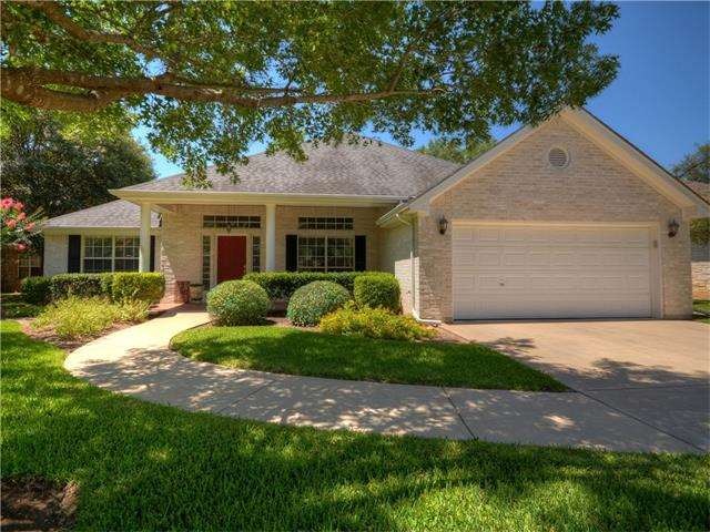 Shady front yard of this pristine property welcome