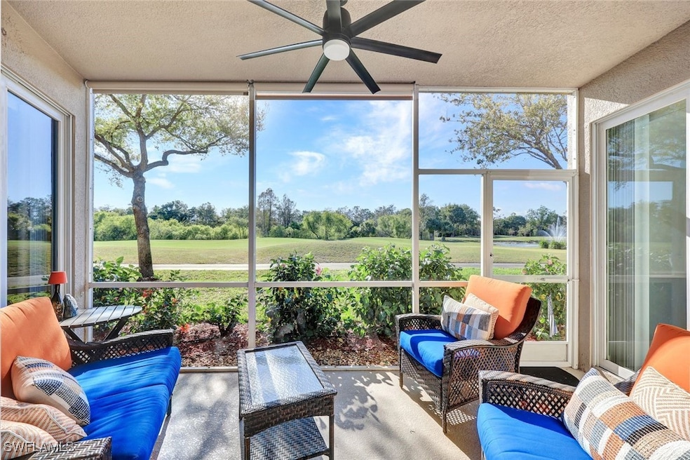 Sunroom / solarium featuring ceiling fan