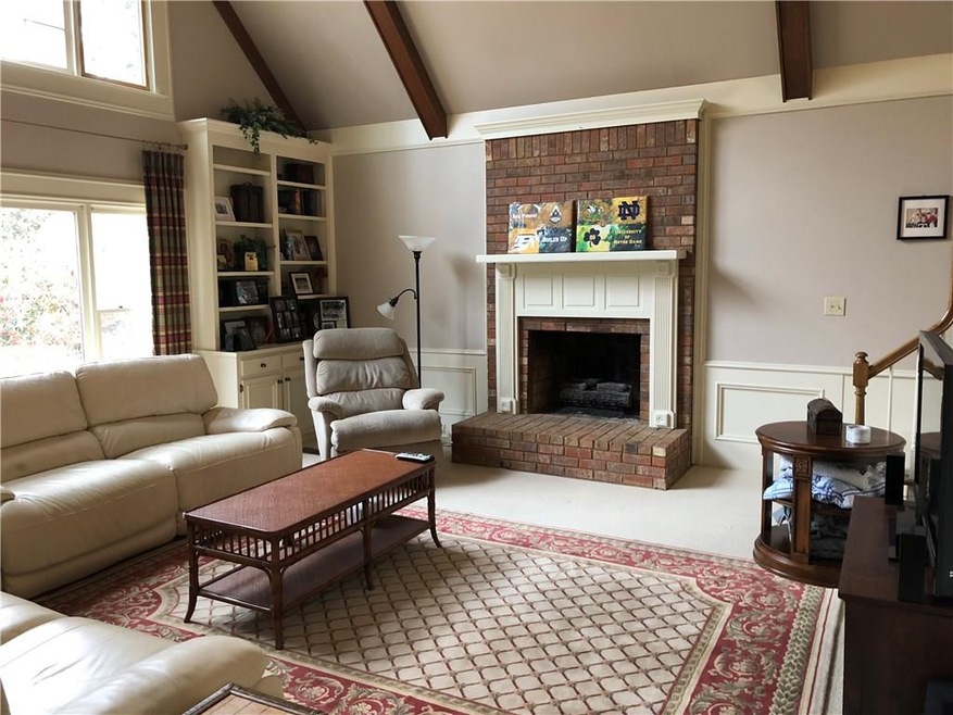 Large Fireside Great Room with Exposed Beam Cathedral Ceiling, Tons of Natural Light thru the Large Windows