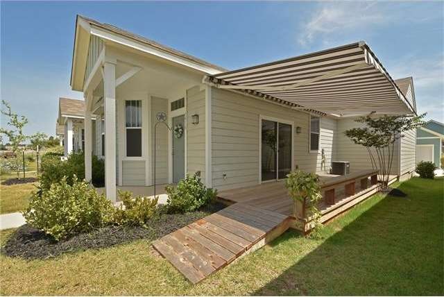 Front/side view with ramp accessible porch and hug