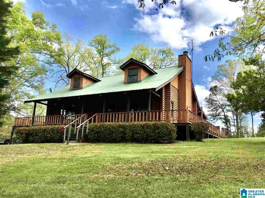 This log home with a guest house, barn, equipment 
