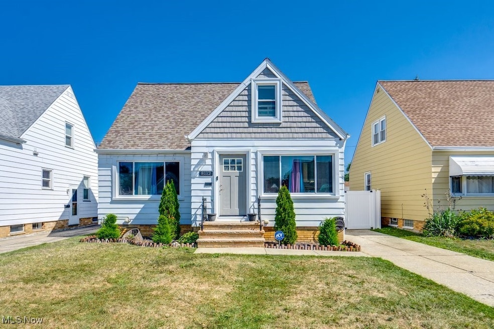 View of front of property with a front lawn