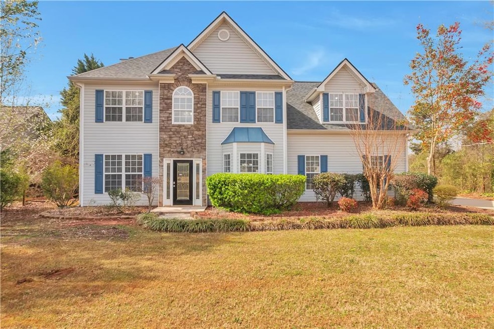 Colonial inspired home with a front lawn