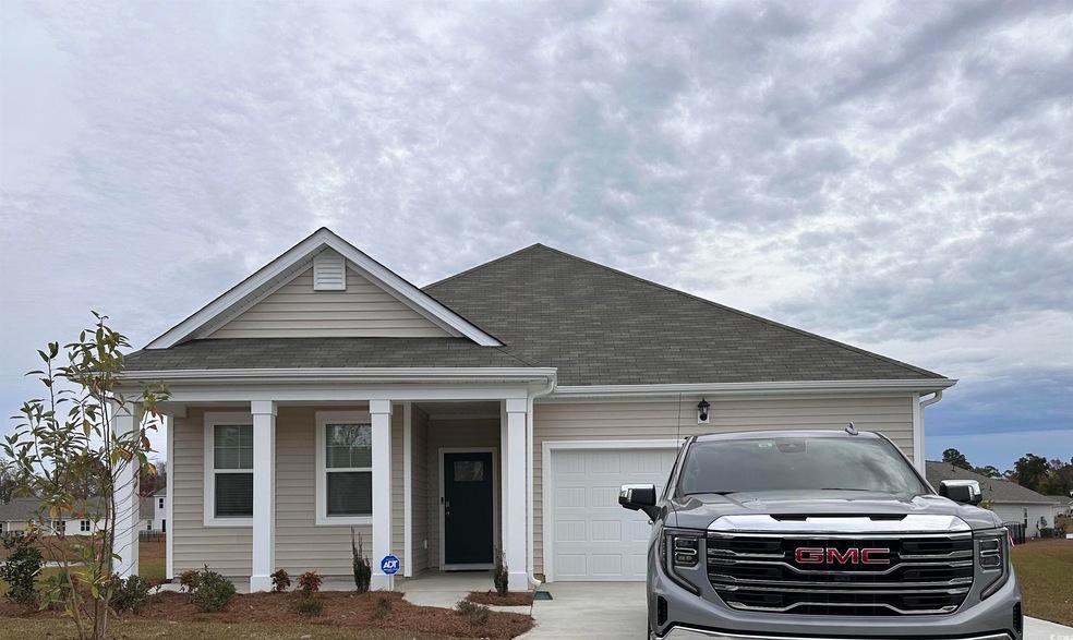 View of front of property featuring a garage