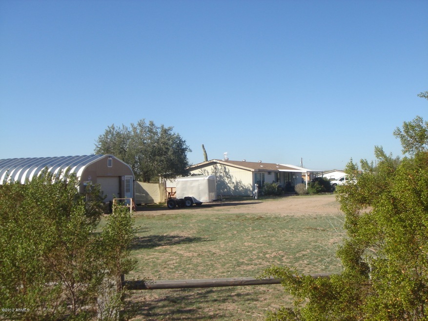 Front view with detached garage
