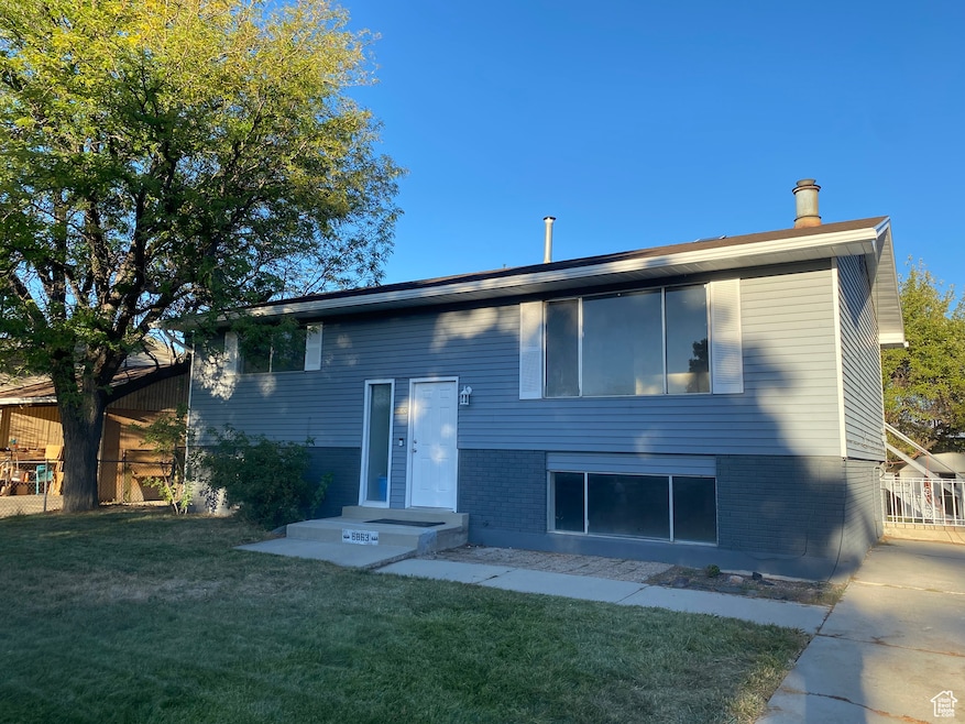 FRONT view of property with brick siding