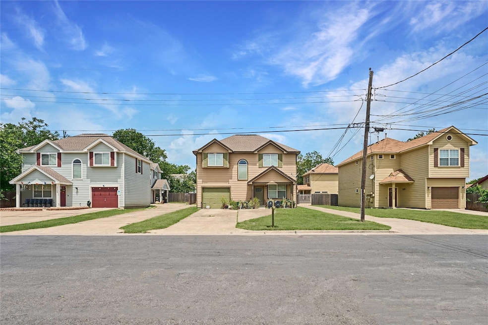 Traditional-style home with a garage, concrete dr