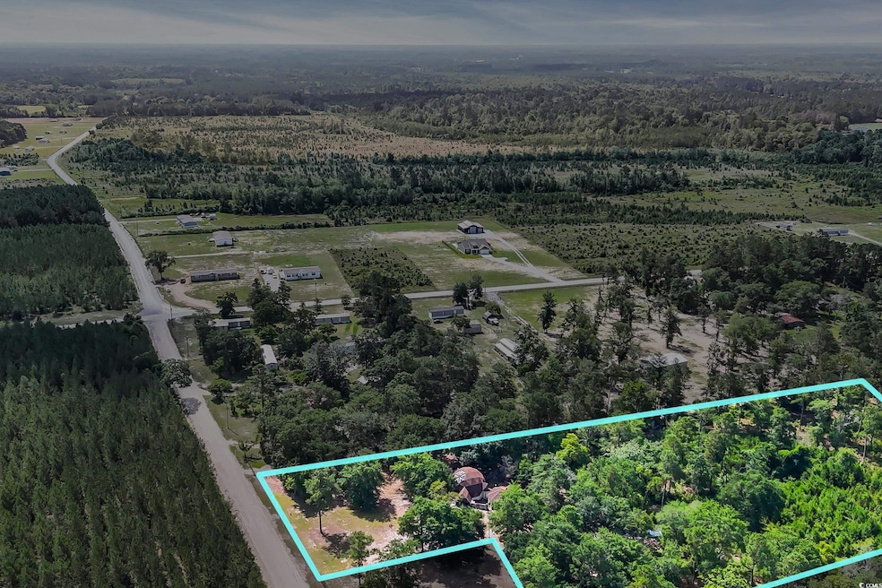 View of rural area with a forest and property parcel outlined