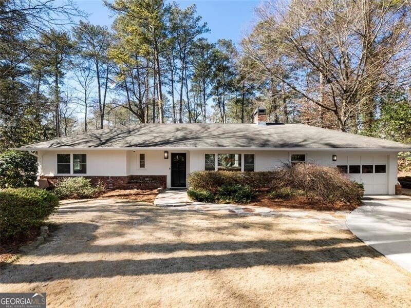 Single story home featuring a garage
