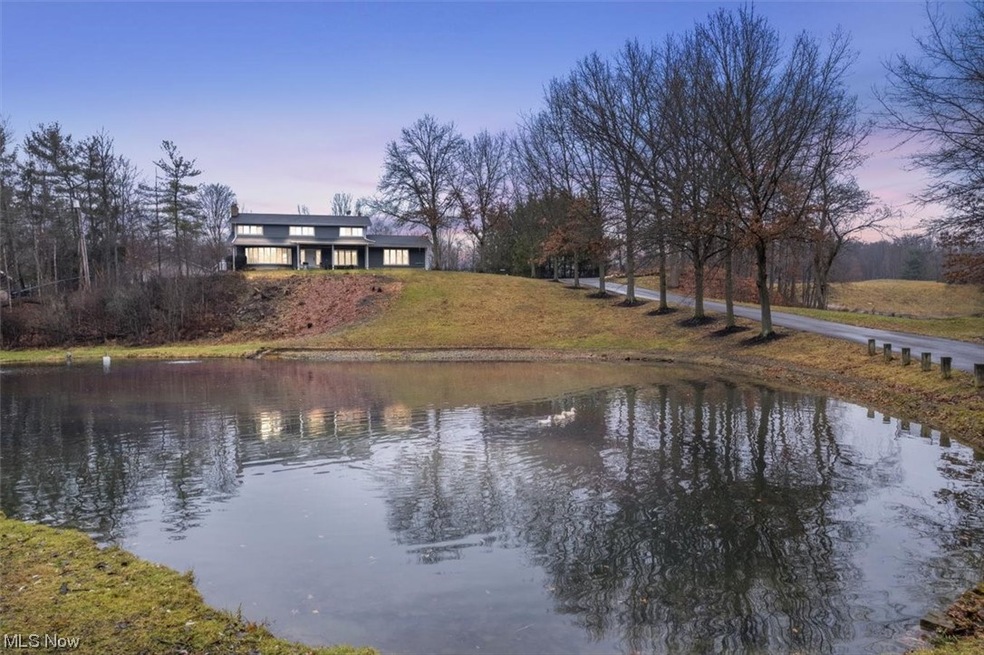 View of pond and front of the house