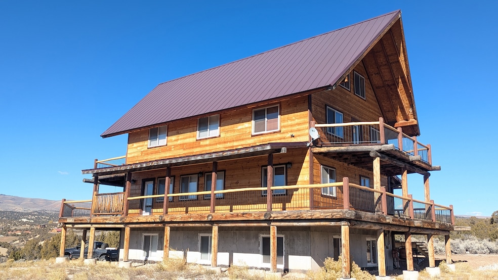 Back of house featuring a metal roof