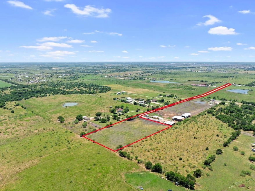 Birds eye view of property featuring a rural view