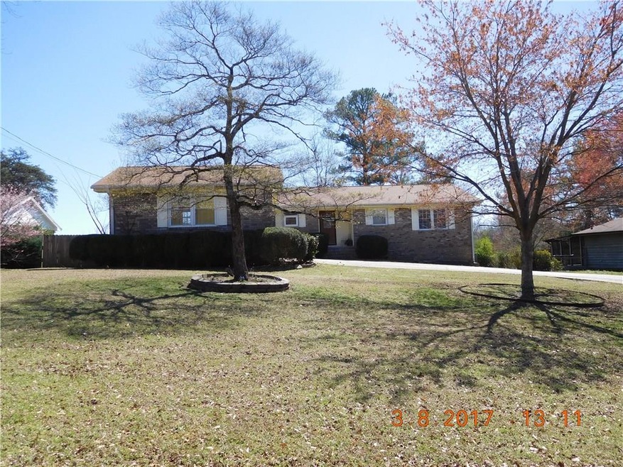 FRONT VIEW OF HOME.  LARGE GENTLY SLOPING LOT.