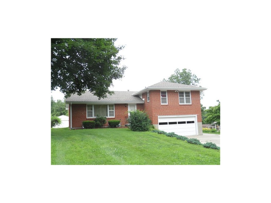 All brick side split with two car attached garage.