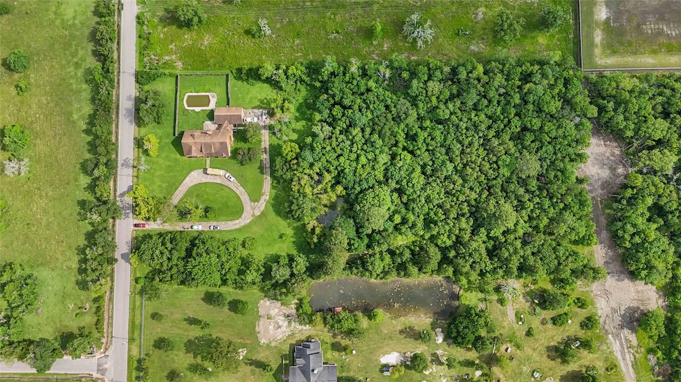The trees are the 5 acres.  The home next door is