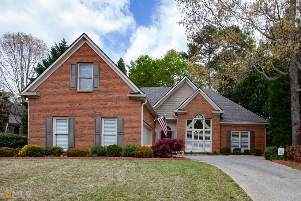 Brick front Ranch with finished loft