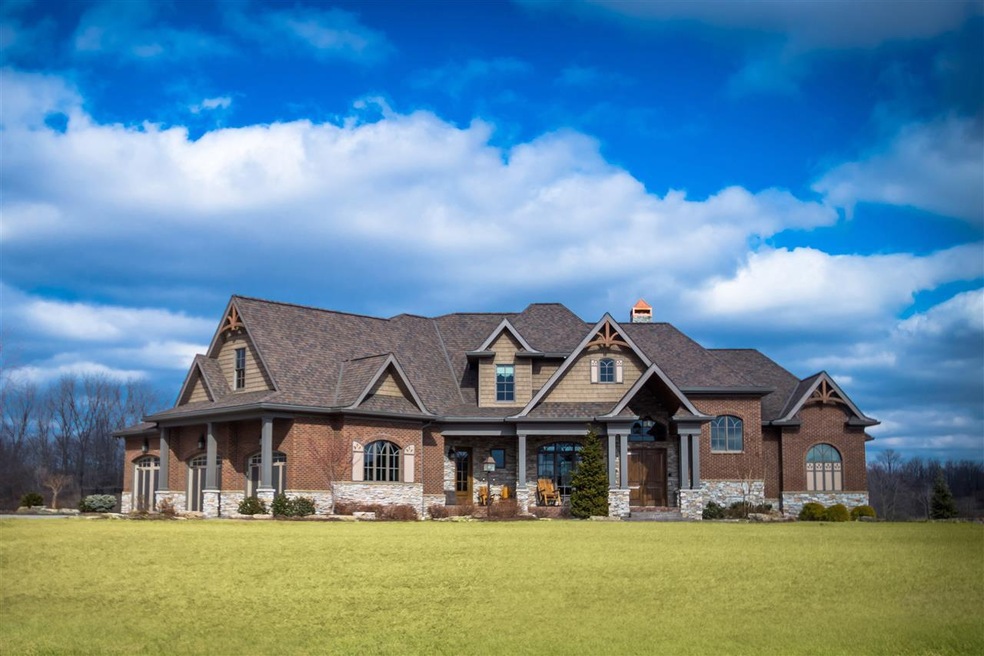 This gorgeous home sits on over 3 acres surrounded